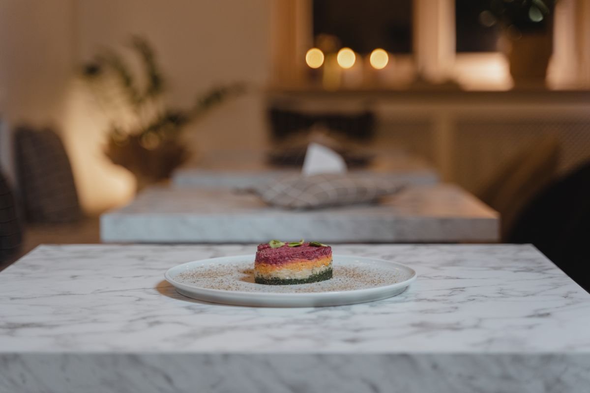 A beautifully presented gourmet dish under warm lighting