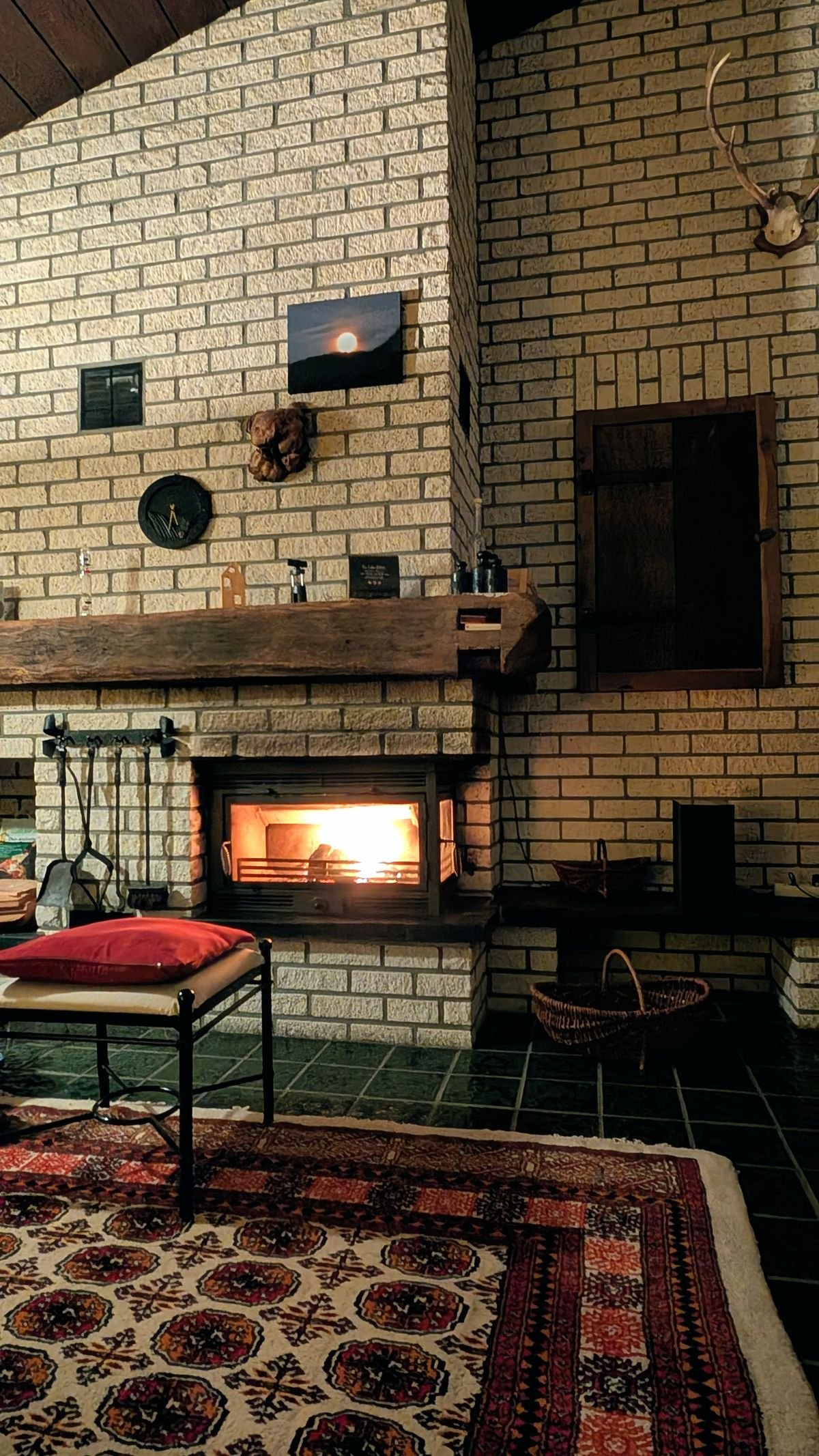 A warm, inviting living room with a lit fireplace