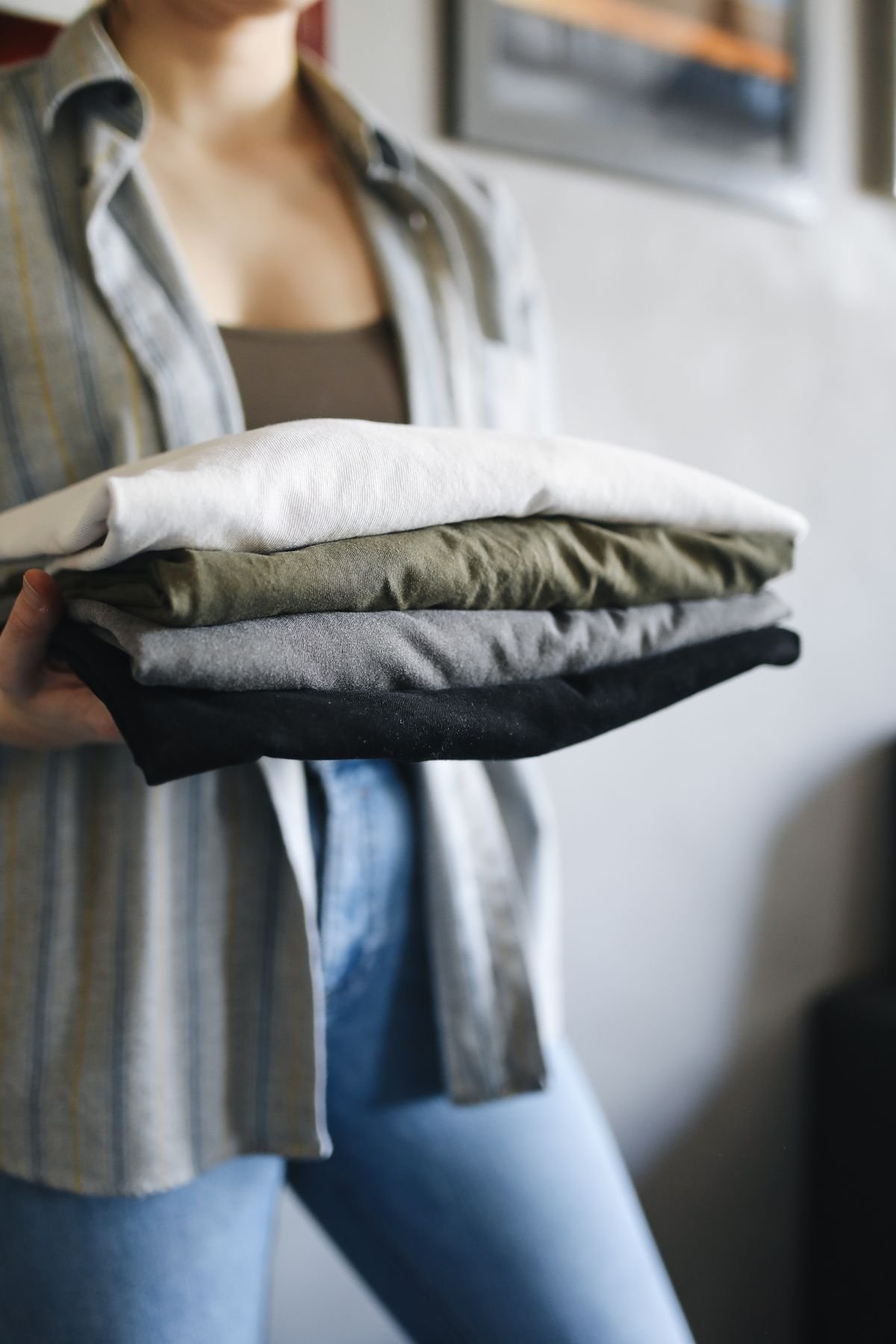 A neat stack of freshly folded shirts